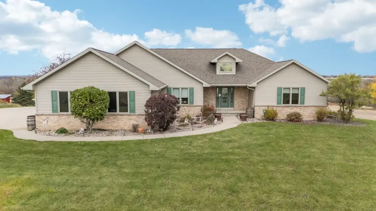 Mark Fasel custom built home with a large yard.