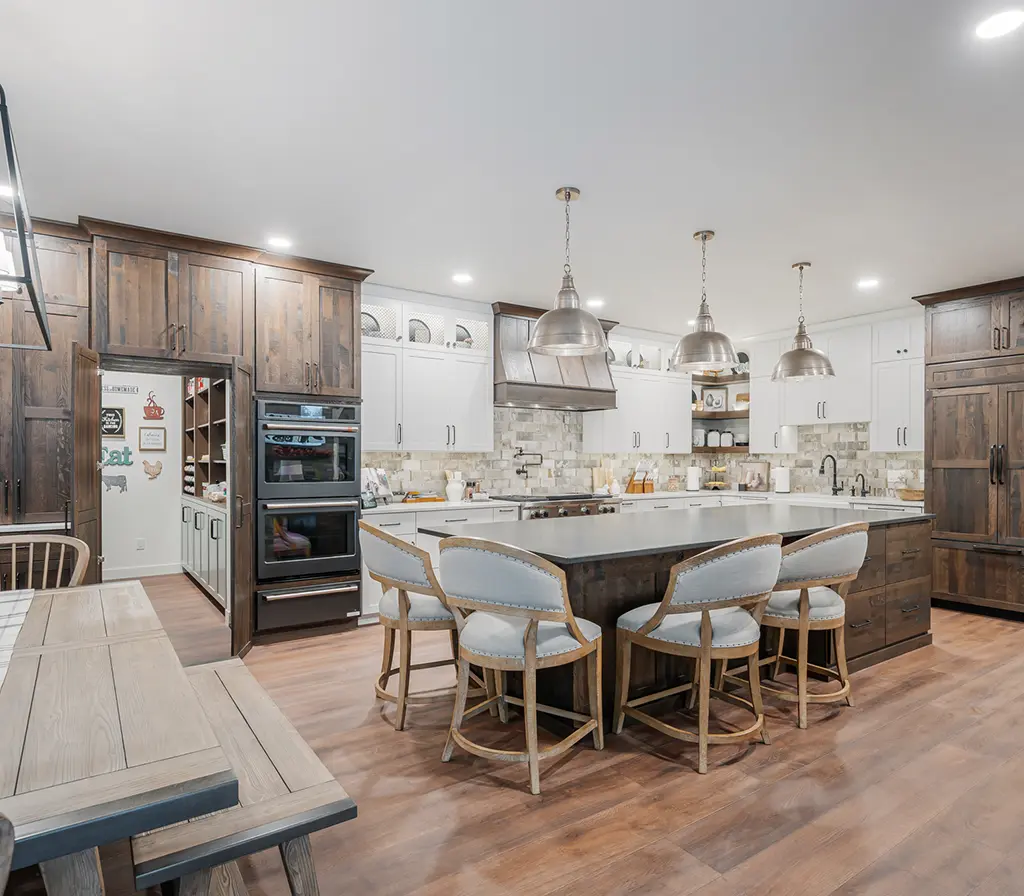 Large custom kitchen with an island and wood floors.